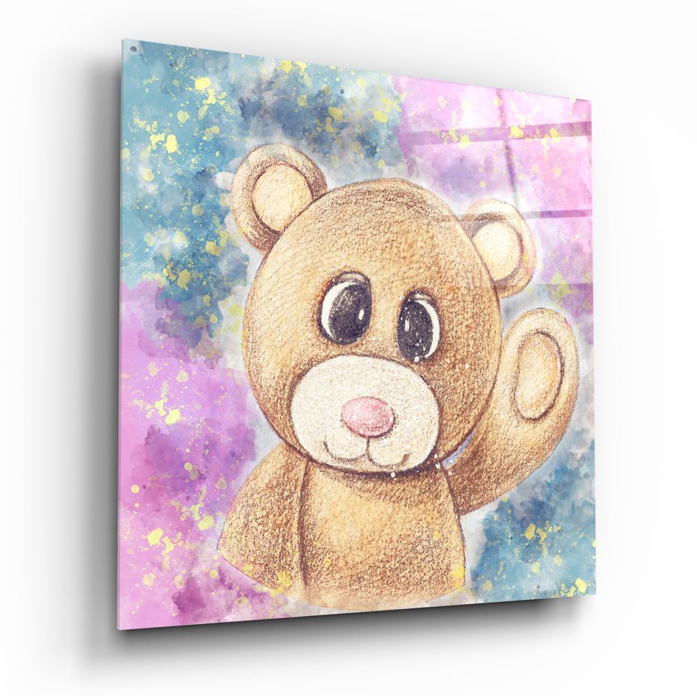 Angled perspective of glass wall art featuring a cute brown teddy bear with large eyes against a watercolor background of pink, blue, and yellow splashes.