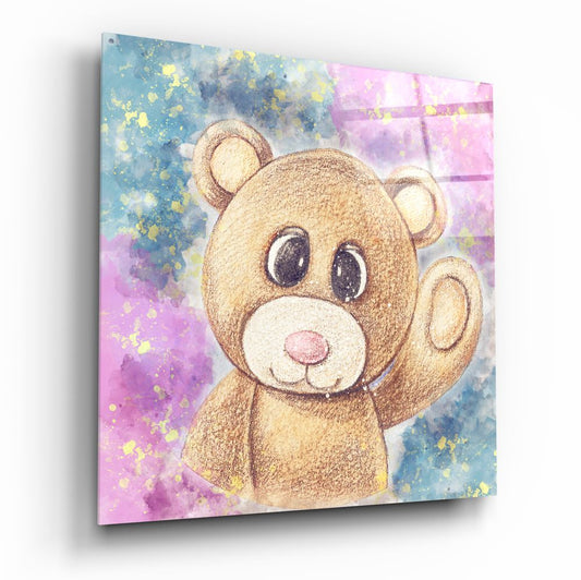 Angled perspective of glass wall art featuring a cute brown teddy bear with large eyes against a watercolor background of pink, blue, and yellow splashes.