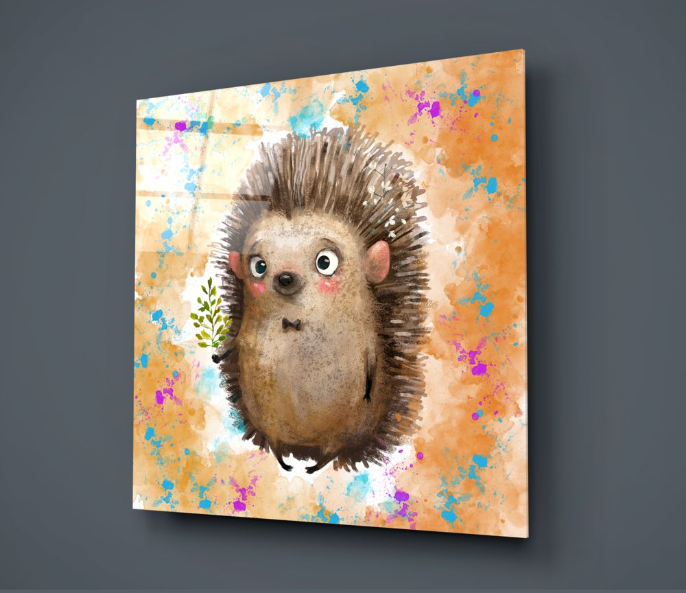 Glass wall art panel displaying a whimsical hedgehog illustration with wide eyes against an orange watercolor background with colorful paint splatters, shown at an angle.