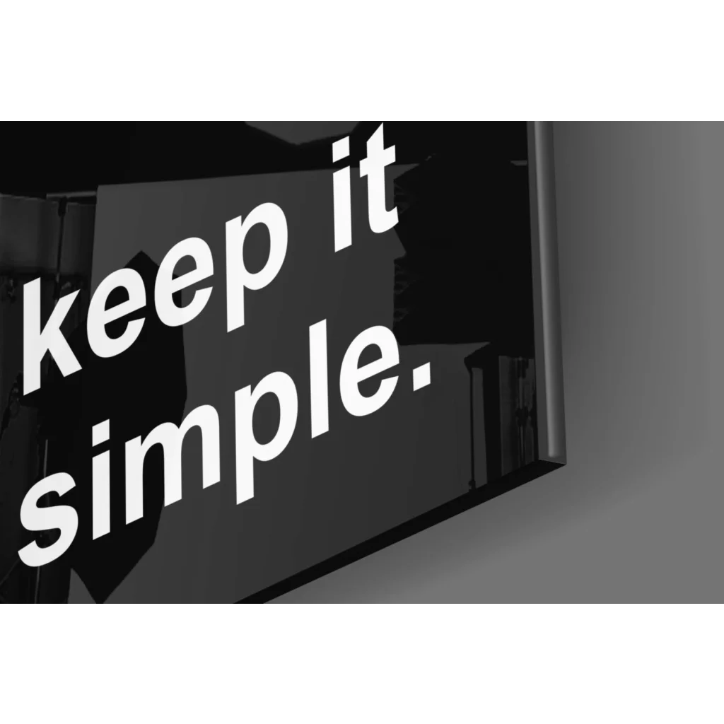 Black rectangular glass wall art sign reading keep it simple for modern homes