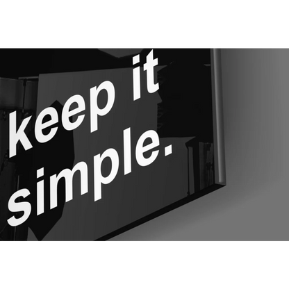 Black rectangular glass wall art sign reading keep it simple for modern homes