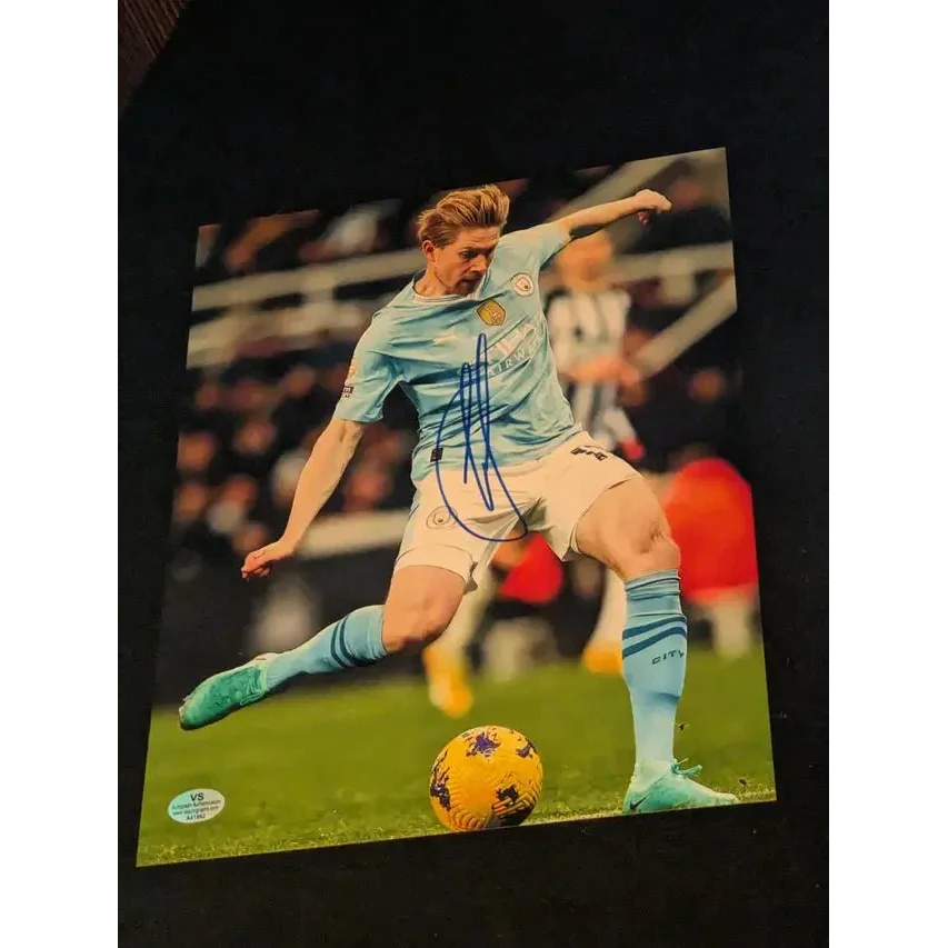 Kevin DeBruyne autographed 8x10 photo of him kicking a yellow ball in action