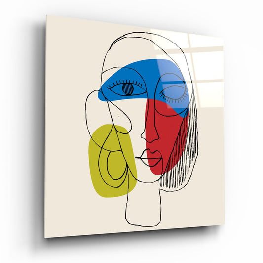 Modern abstract lineart face glass wall art with blue, red, and yellow geometric color blocks on cream background, displayed at angle.
