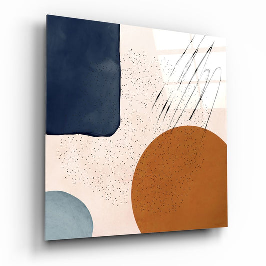 Square glass wall art panel angled perspective showing navy, terracotta, and blue abstract shapes with line details on cream speckled background.