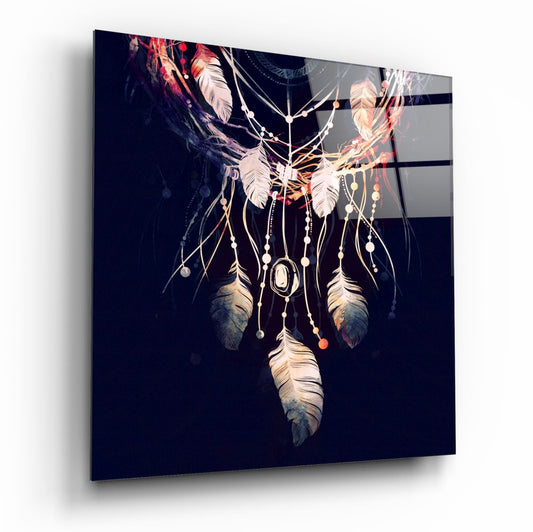 Dreamcatcher glass wall art with feathers and beads against dark navy background, displayed at angled perspective.