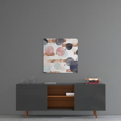Abstract glass wall art with pink, brown, navy, and white circles and brushstrokes displayed above mid-century modern credenza.