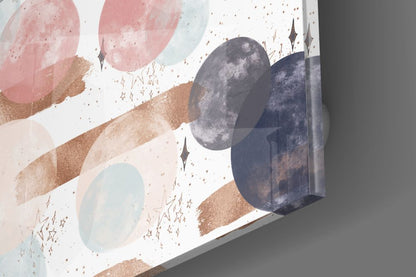 Three-dimensional glass wall art piece mounted at an angle, displaying moons, gold brushstrokes, stars, and pastel colors against white background.