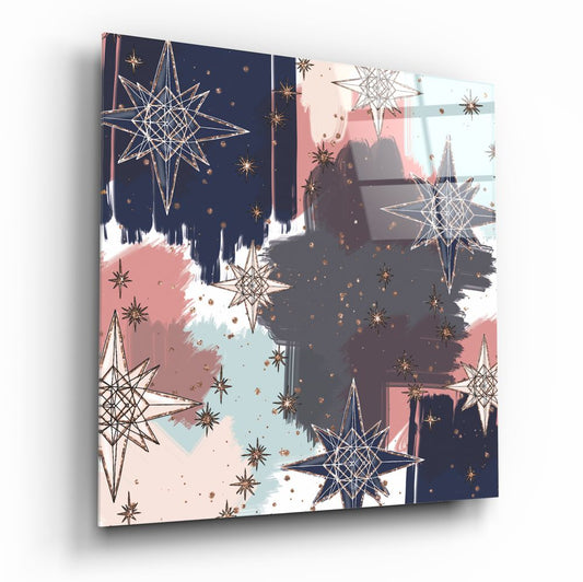 Angled perspective of glass wall art displaying navy, blush, and white brushstrokes with geometric eight-point stars and gold accents.