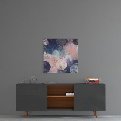 Dreamy Space Glass Wall Art displaying moons and celestial bodies in pink, blue, and gold tones, hung above a mid-century modern console table.
