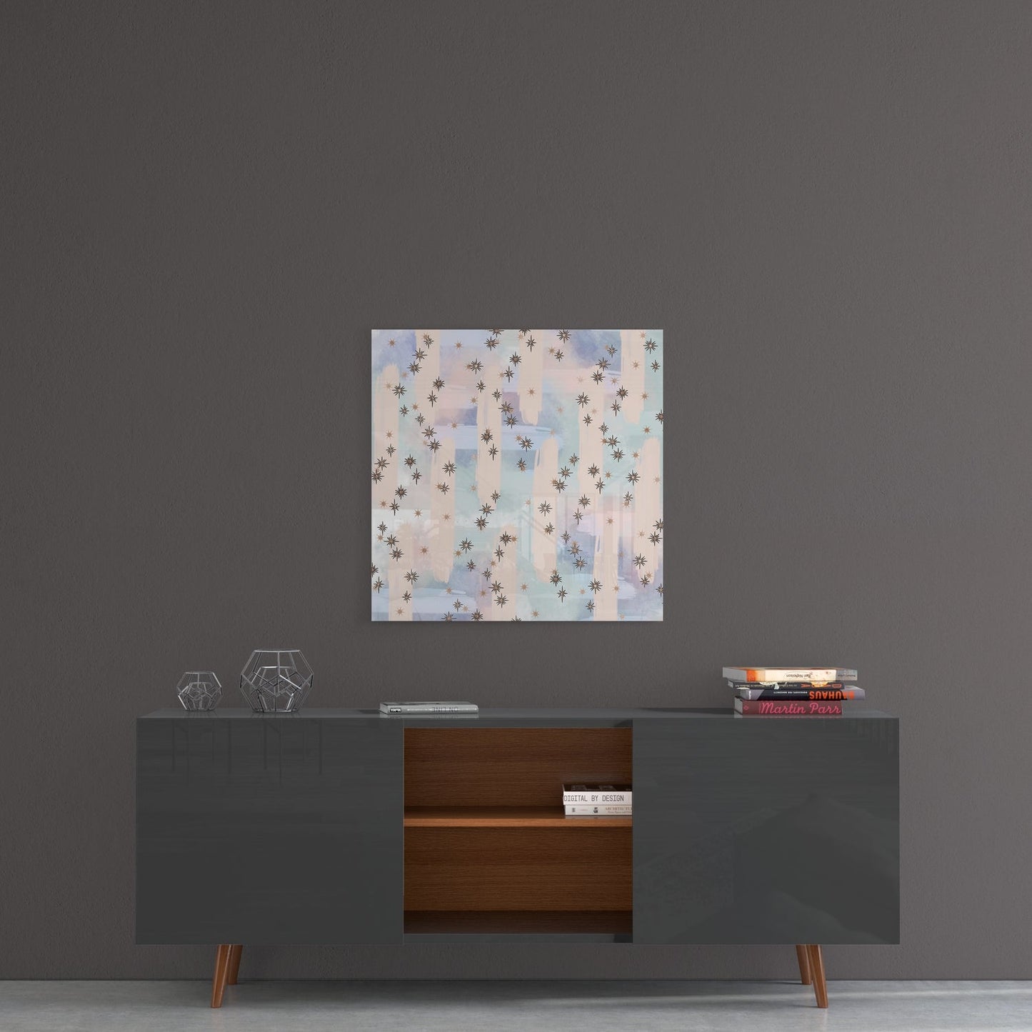 Dreamy Stars Glass Wall Art hanging above a mid-century modern credenza with geometric décor and stacked books.