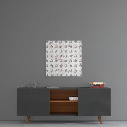 Moon and star patterned glass wall art hanging above a mid-century modern console table against gray wall.
