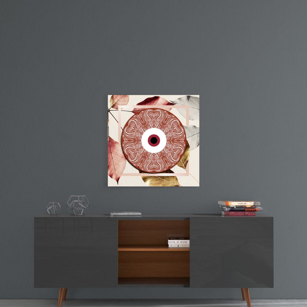 Red evil eye glass wall art with ornate circular pattern and autumn leaves displayed above mid-century modern console table.