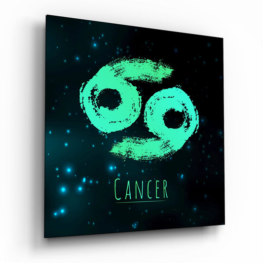 Angled perspective of glass wall art displaying a mint green Cancer zodiac symbol with brushstroke texture on a starry dark background.