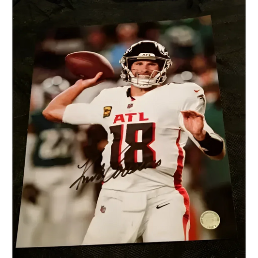 Autographed Kirk Cousins photo in white ATL uniform with 18, certified sports memorabilia