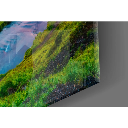 Vibrant mossy hillside on glass wall art with Iceland waterfall sunset