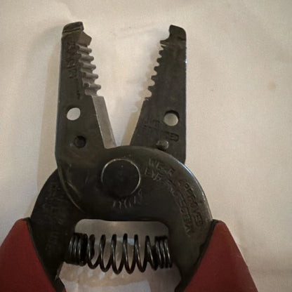 Klein Tools wire stripper cutter pliers with red handles, serrated jaws
