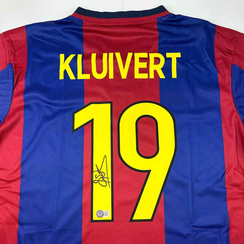 Kluivert signed Barcelona jersey with red and blue stripes, yellow lettering, number 19