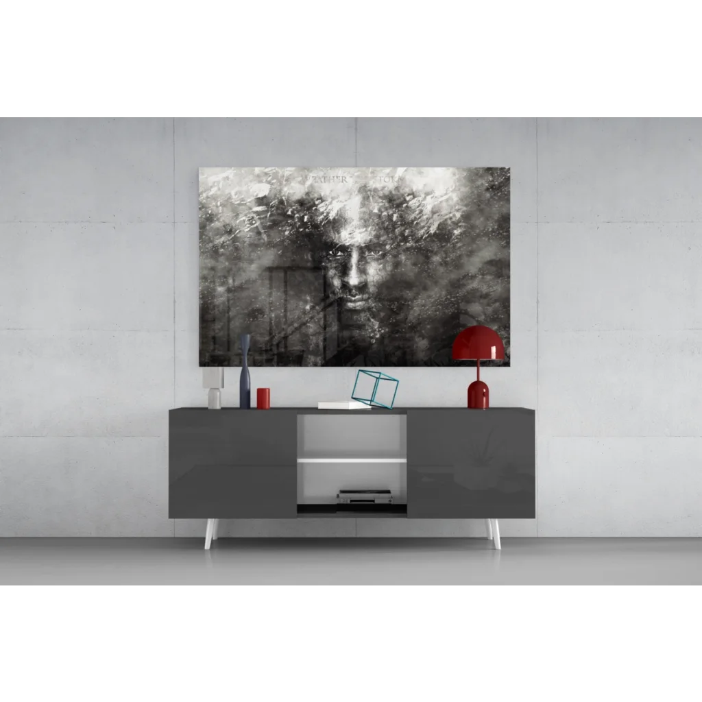 Modern gray console table with white legs under Haunting Face wall art