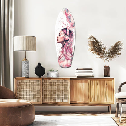 Oval glass wall art featuring a pink-haired woman wearing headphones displayed above a wooden mid-century credenza in a modern living room.