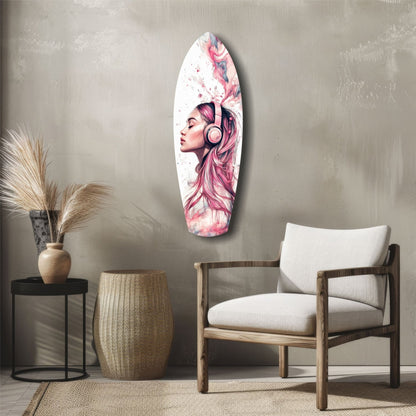 Oval glass wall art displaying pink-haired woman with headphones in watercolor style, mounted above mid-century modern furniture in neutral room.