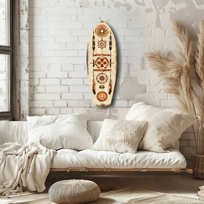 Oval wooden wall art with geometric Aztec patterns in red, orange, and brown on cream background, displayed above white bedding in minimalist bedroom.