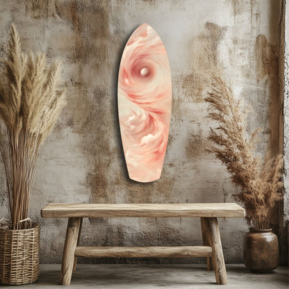 Pinky Swirl Glass Wall Art hanging above wooden bench, displaying soft pink and white spiral pattern against rustic concrete wall with dried grasses.