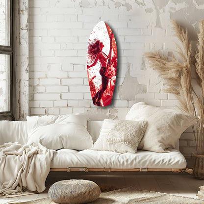 Red and white glass wall art featuring an abstract figure displayed above a cream upholstered daybed in a minimalist bedroom.