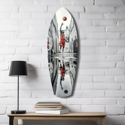White oval glass wall art displaying street basketball player in red jersey shooting ball, mounted above wooden desk with lamp and books.