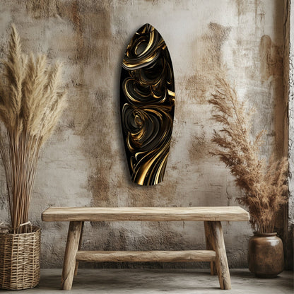 Black and gold swirled glass wall art hanging above wooden bench in rustic interior with dried grasses.