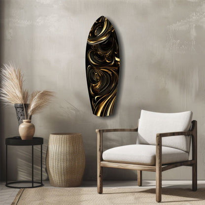 Black and gold swirled glass wall art displayed above a wooden chair in a minimalist interior setting.