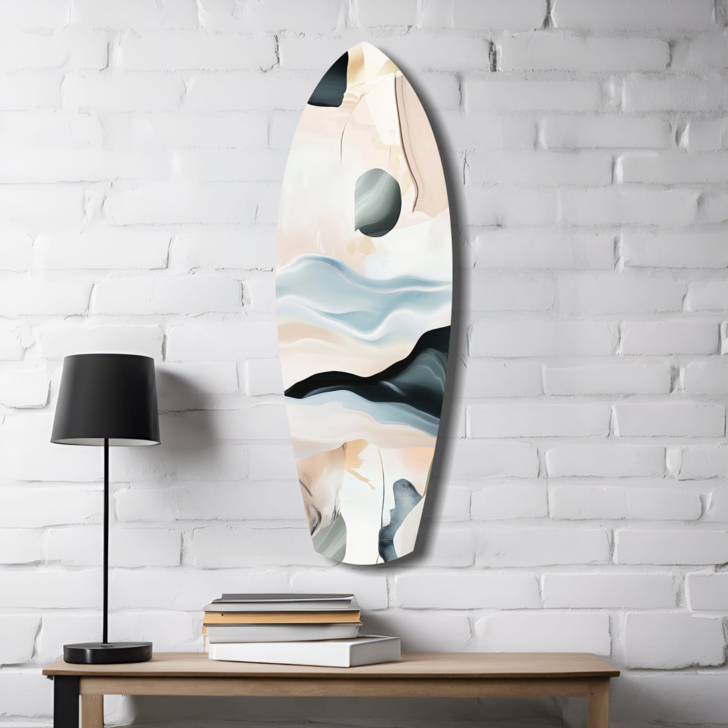 Abstract sailing glass wall art mounted on white brick above wooden desk with black lamp and stacked books.