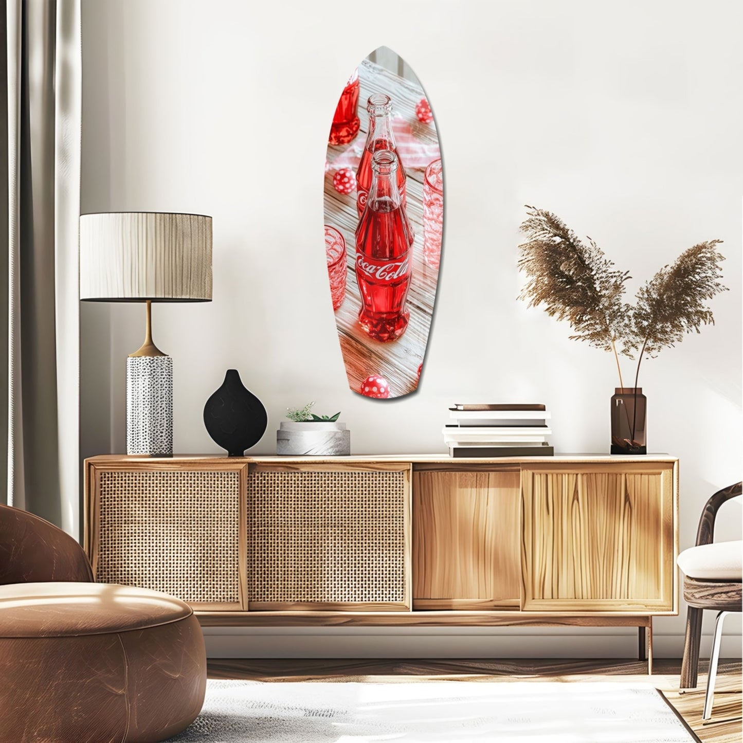 Red Coca-Cola bottle glass wall art displayed above wooden credenza in mid-century modern living room setting with warm lighting and decorative accessories.
