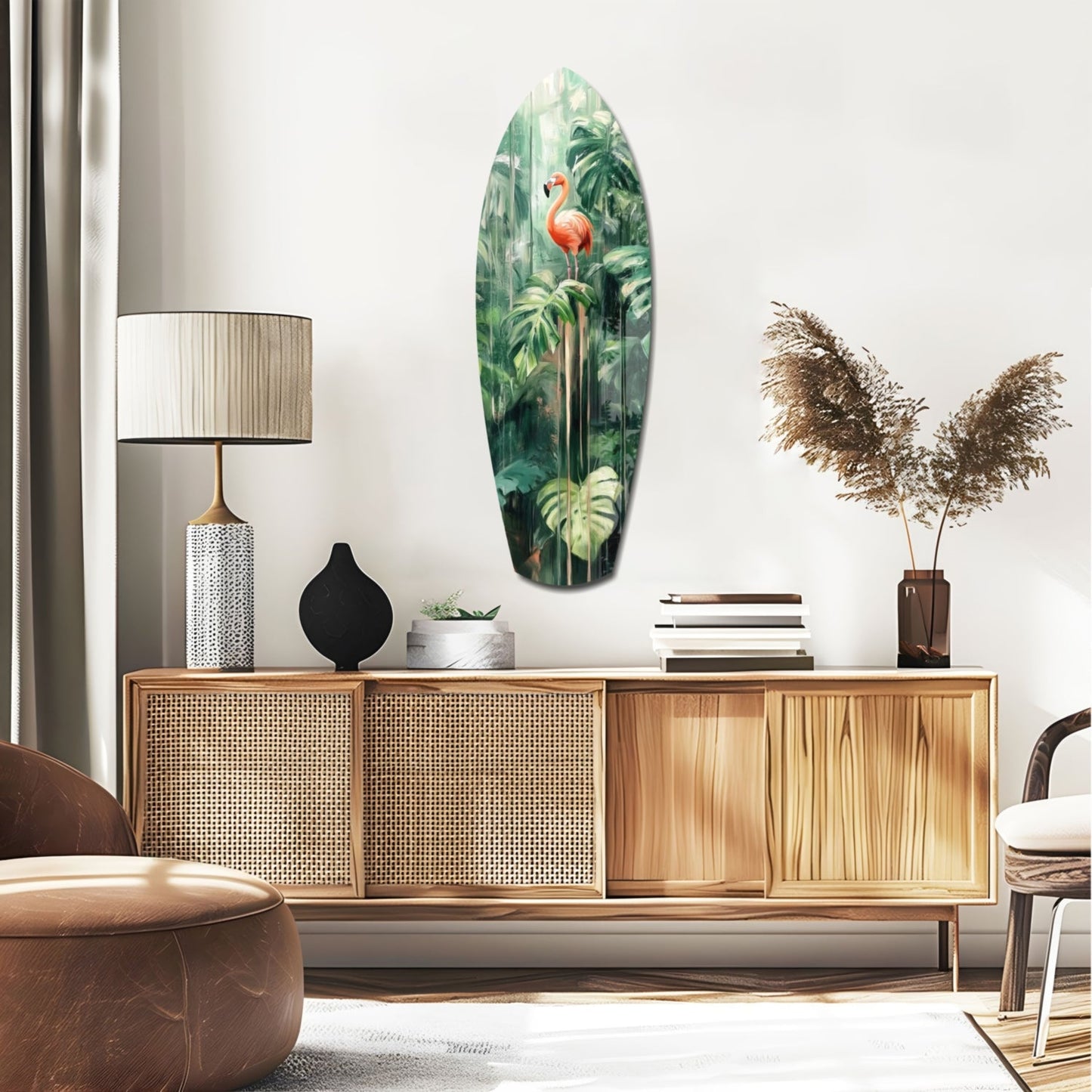 Oval glass wall art featuring a pink flamingo among lush green tropical foliage, displayed above a wooden sideboard in a modern living room.
