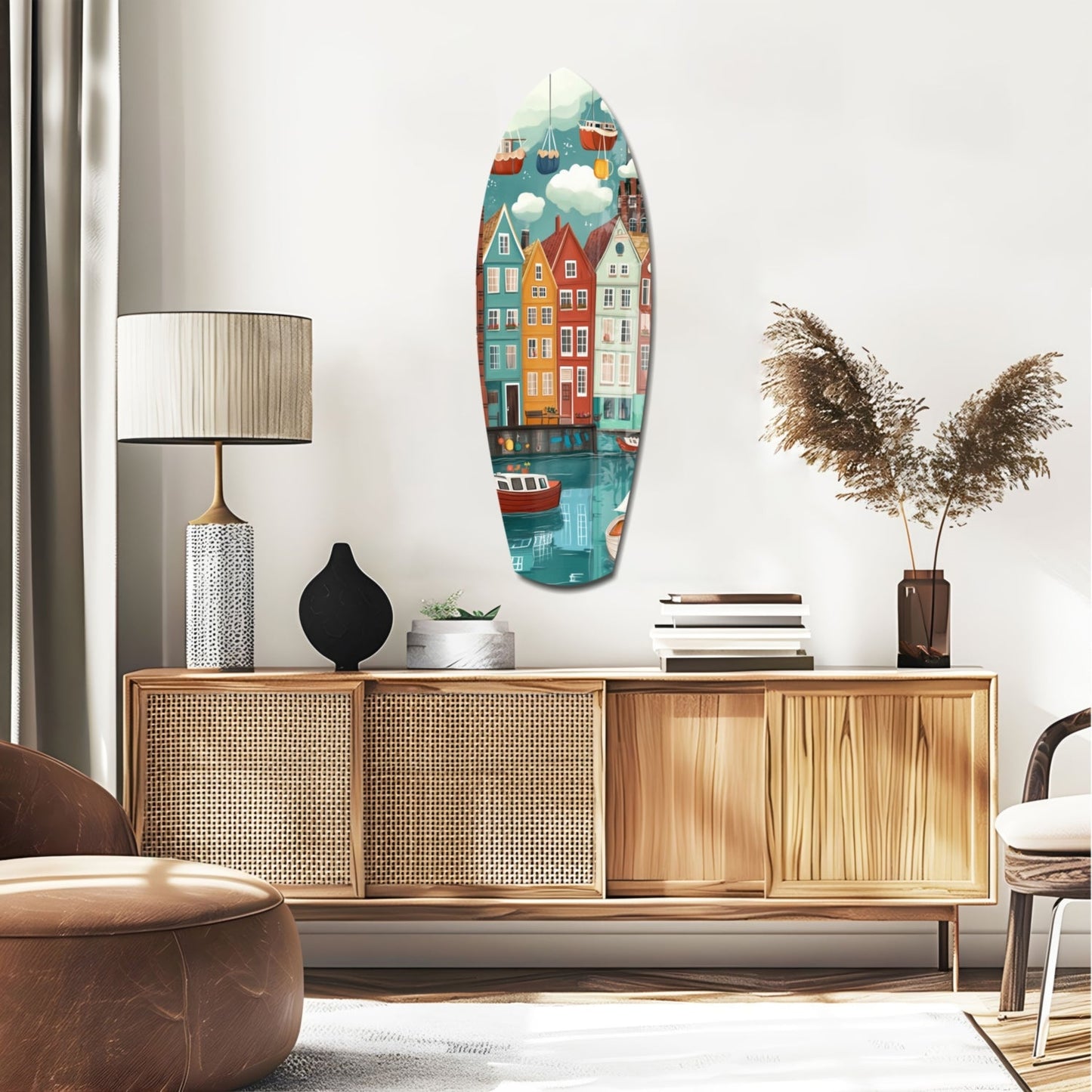 Coastal village glass wall art in boat shape displays colorful waterfront houses, boats, and clouds above wooden mid-century furniture.
