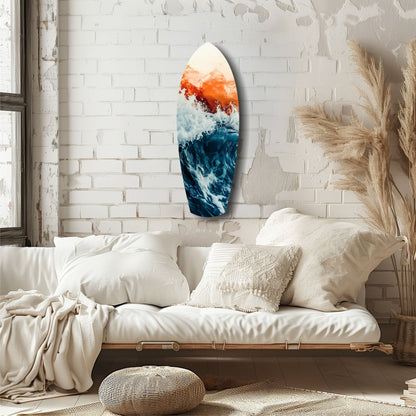 Oval glass wall art featuring orange sunset gradient above deep blue ocean waves, displayed above a cream-colored bed in a minimalist bedroom.