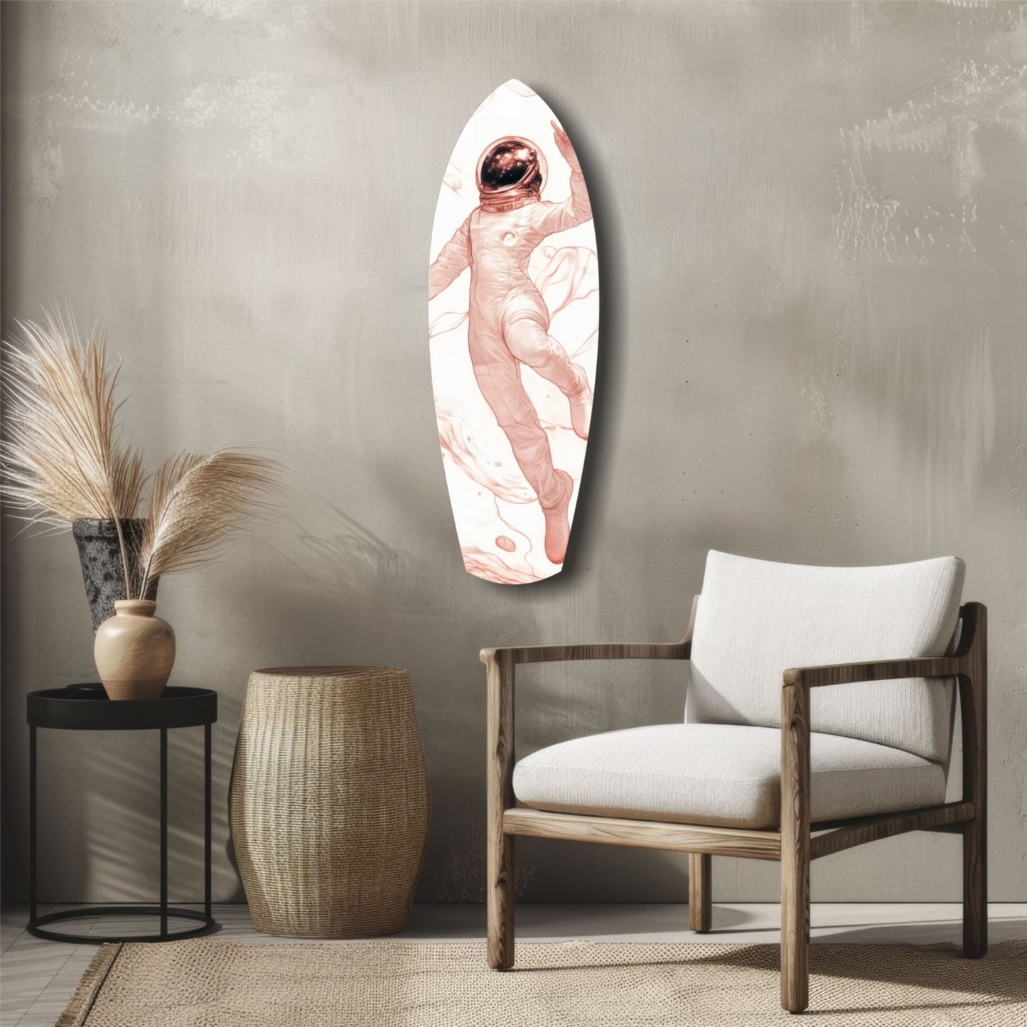 Oval glass wall art depicting a pink-suited astronaut floating in white space, displayed above a wooden chair in a minimalist interior setting.