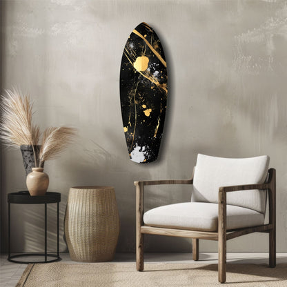 Black and gold stained glass wall art displayed above a wooden chair in a minimalist interior setting.