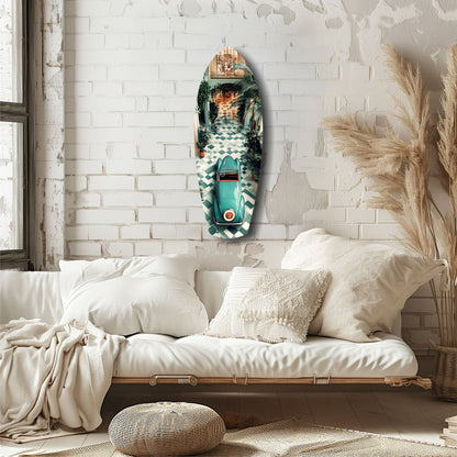 Turquoise vintage car glass wall art mounted above a cream linen sofa in a minimalist bedroom with white brick walls.