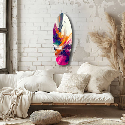 Colorful abstract glass wall art with swirling paint strokes in vibrant blues, purples, oranges, and pinks displayed above a neutral bedroom sofa.
