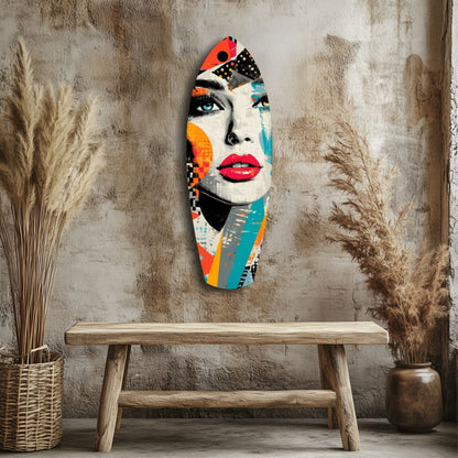 Colorful pop art glass wall sculpture of a woman's face with red lips and geometric patterns displayed above a wooden bench against a textured beige wall.