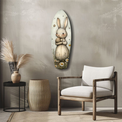 Oval glass wall art featuring a cream-colored rabbit holding a pinecone, surrounded by small flowers and decorative elements, displayed above mid-century furniture in a neutral interior.