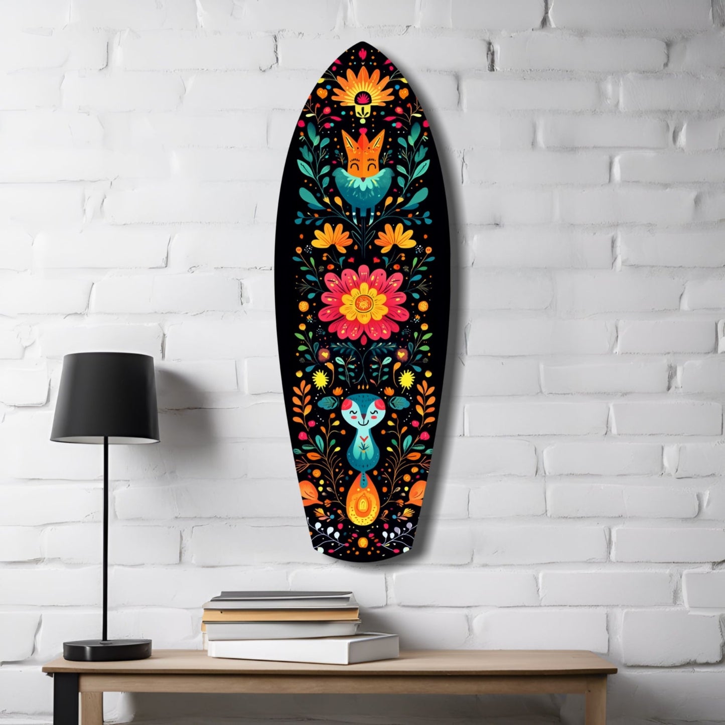 Oval glass wall art featuring colorful folk-art flowers, foxes, and rabbits on black background, displayed above wooden desk with lamp and books.