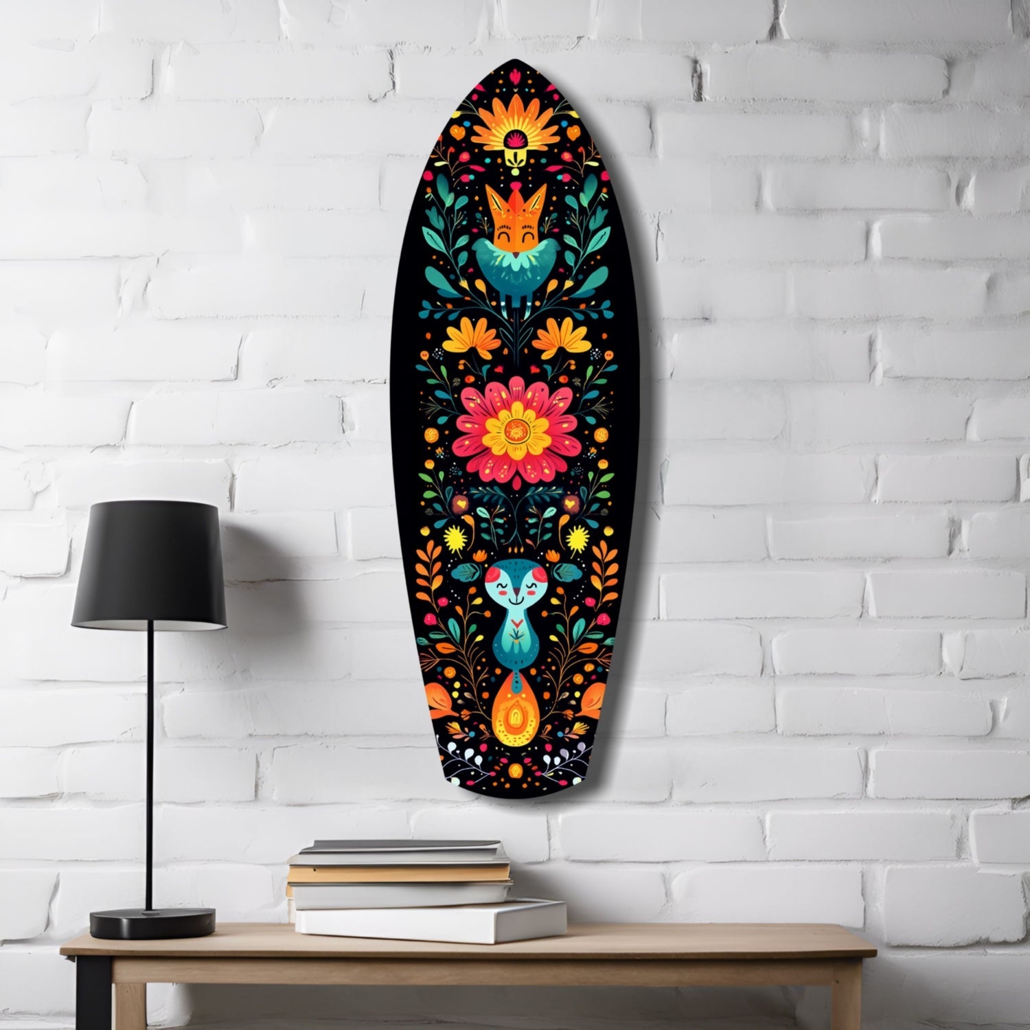 Oval glass wall art featuring colorful folk-art flowers, foxes, and rabbits on black background, displayed above wooden desk with lamp and books.