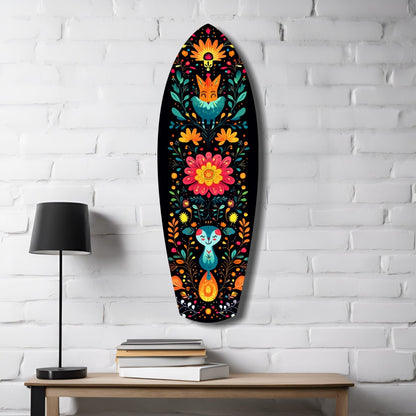 Oval glass wall art featuring colorful folk-art flowers, foxes, and rabbits on black background, displayed above wooden desk with lamp and books.