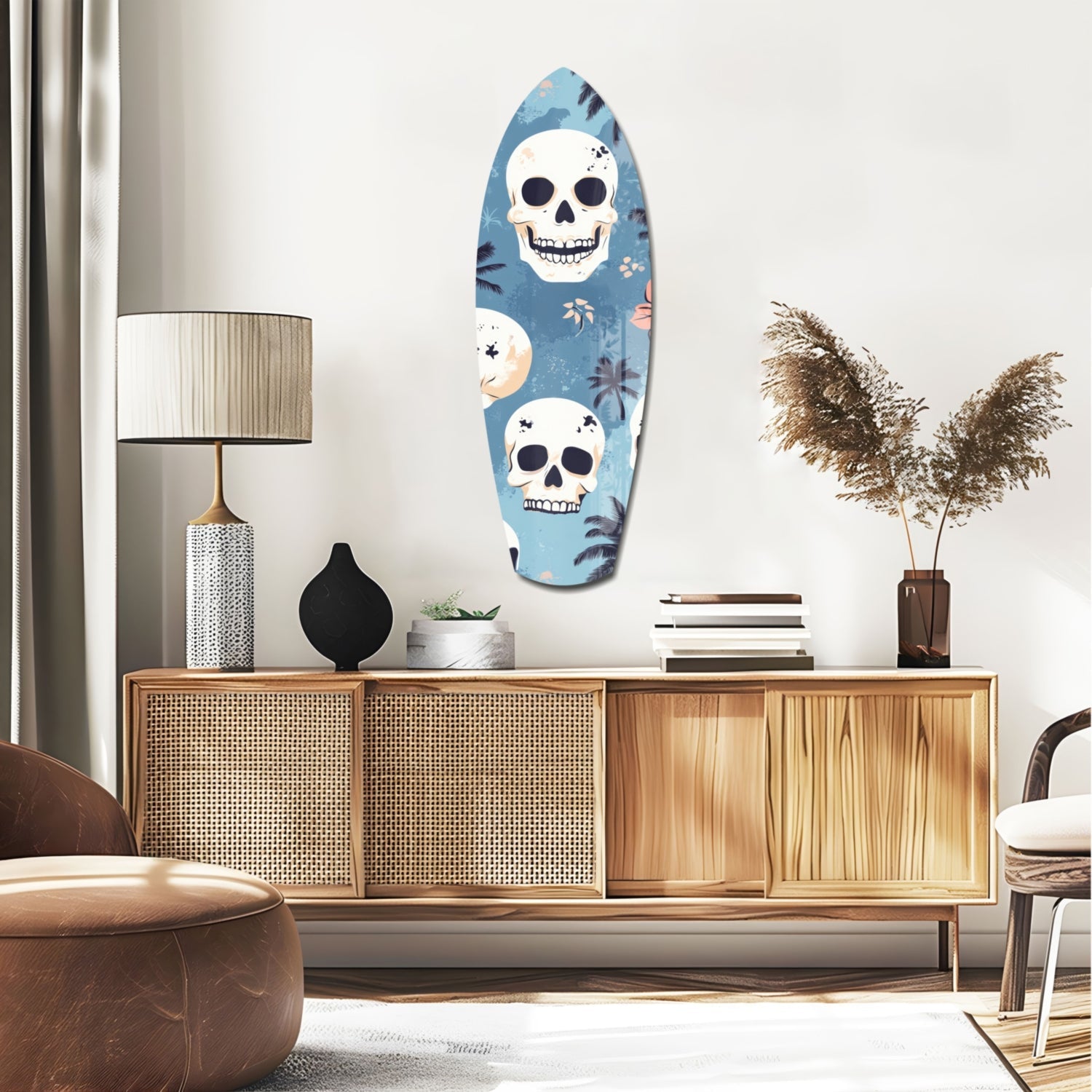 Surfboard-shaped glass wall art with two white skulls and tropical foliage on blue background, displayed above wooden mid-century dresser in modern living room.