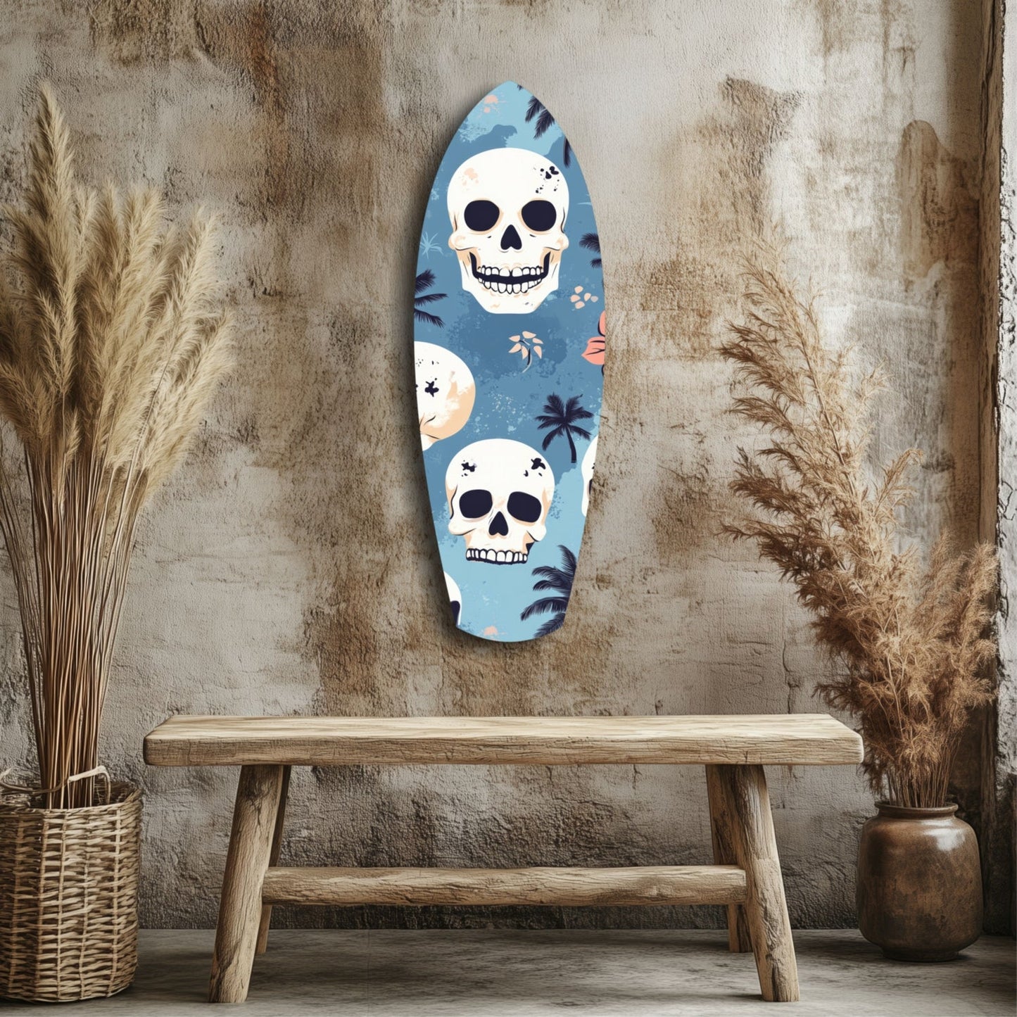 Blue glass surfboard wall art with two white skulls and tropical palm leaf motifs, displayed above wooden bench against textured concrete wall.