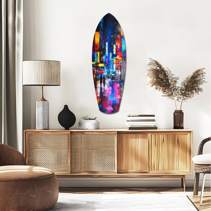 Colorful oval glass wall art with vibrant blue, purple, pink, and yellow cityscape displayed above wooden mid-century credenza in modern living room setting.