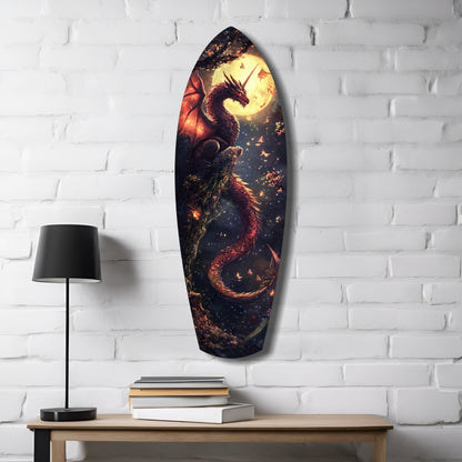 Oval glass wall art depicting a dark dragon silhouette against glowing yellow moon and red flames, displayed on white brick wall above wooden desk with lamp and books.