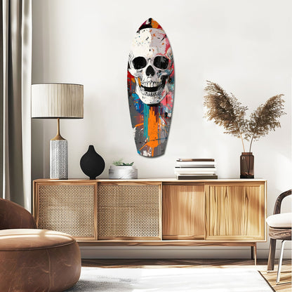 Colorful skull surfboard wall art displayed above wooden mid-century modern credenza in contemporary living room setting.