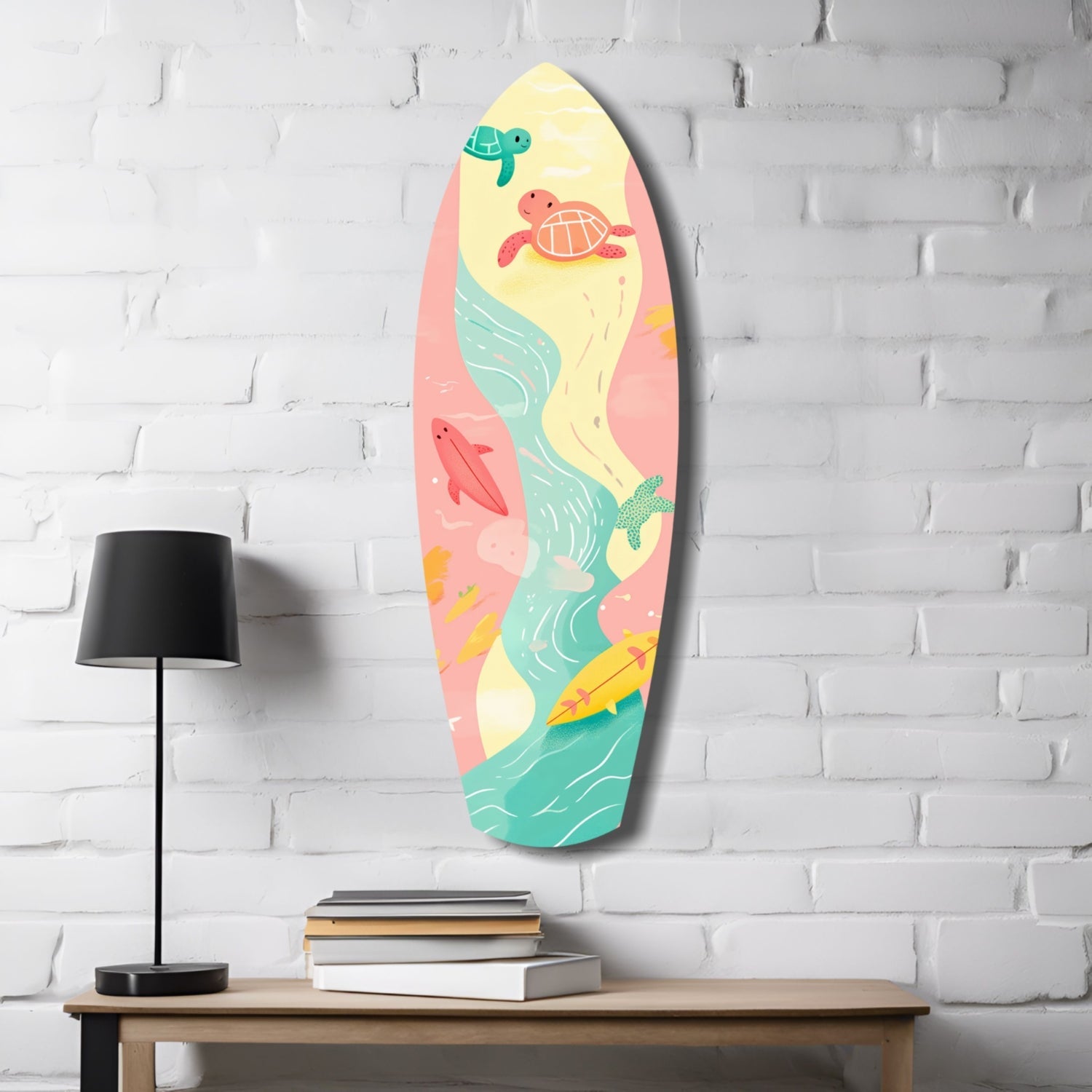 Colorful surfboard-shaped wall art with sea turtles and ocean waves in pink, yellow, and turquoise, displayed on white brick wall above wooden table with lamp and books.